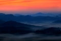 Cold misty foggy morning with twilight sunrise in a fall valley of Bohemian Switzerland park. Hills with fog, landscape of Czech Royalty Free Stock Photo