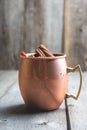 Cold Moscow Mule cocktail in copper mug on the rustic background Royalty Free Stock Photo