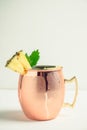 Cold Moscow Mule cocktail in copper mug on the rustic background Royalty Free Stock Photo