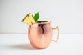 Cold Moscow Mule cocktail in copper mug on the rustic background Royalty Free Stock Photo