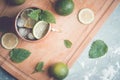 Cold Moscow Mule cocktail in copper mug on the rustic background Royalty Free Stock Photo