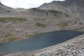 Cold mountain lake. Near the Trollstigen, Norway. Royalty Free Stock Photo