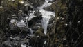 Cold Mountain stream flowing over the big rocks. Creative. River flowing surrounded by autumn nature. Royalty Free Stock Photo