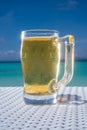 Cold mug of beer on the table at the beach restaurant Royalty Free Stock Photo