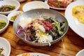 Cold noodle with vegetables, tofu, seaweed, sauce kimchi in zinc bowl