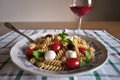 Cold Pasta With Mini Mozzarella, Cherry Tomato, Basil Leaves, Black Olives And RosÃÂ© Wine Cerasuoloe
