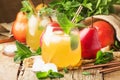 Cold pear juice, iced summer non-alcoholic cocktail with mint, old wooden table background, selective focus Royalty Free Stock Photo