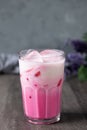 cold pink milk cold drink in clear glass on gray background. Thai milk Royalty Free Stock Photo