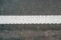 Cold plastic structured stripes with dot pattern for road surface marking as background Royalty Free Stock Photo