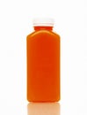 Cold-pressed carrot juice for detoxification against a white background. Juice from organic fruits and vegetables. Royalty Free Stock Photo
