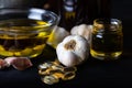 Cold pressed garlic oil in bowl with  garlic oil capsule on dark background. Royalty Free Stock Photo