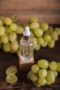 Cold pressed grape oil. Organic bio care products with natural ingredients. Close-up grapes and copy space. Halved grapes and grap