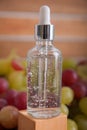 Cold pressed grape oil. Organic bio care products with natural ingredients. Close-up grapes and copy space. Halved grapes and grap