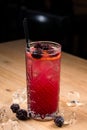 cold red lemonade with blackberries and ice