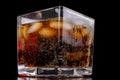 A cold refreshing drink with ice in a glass. Ice cubes and a sweet cold drink in a glass dish Royalty Free Stock Photo