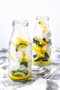 Cold and refreshing infused detox water with lemon, mint and cucumber in a glass on white background Royalty Free Stock Photo