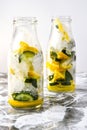 Cold and refreshing infused detox water with lemon, mint and cucumber in a glass on white background Royalty Free Stock Photo
