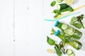 Cold and refreshing infused detox water with lime, mint and cucumber in a bottle on white wood background Royalty Free Stock Photo