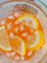 Cold refreshing limonade, gin tonic in glass, with fresh mint and ice cubes, lime and lemon on wooden table. Summer Royalty Free Stock Photo