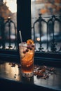 Cold and refreshing orange punch cocktail in a glass with fruit slice. Summer citrus drink Royalty Free Stock Photo