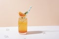 Cold and refreshing orange punch cocktail with orange slice on color background. summer drink Royalty Free Stock Photo