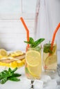 Cold refreshing summer drink with lemon and mint on wooden background Royalty Free Stock Photo