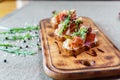 Platter: cold salmon bruschetta and greens with a glass of champagne Royalty Free Stock Photo