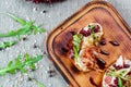 Platter: cold salmon bruschetta and greens with a glass of champagne Royalty Free Stock Photo