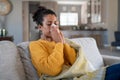 Cold sick african woman blowing nose Royalty Free Stock Photo