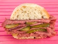 Cold Sliced Salt Beef or Pastrami With Gherkins in a Ciabatta Bread Roll or