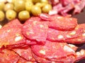 Cold-smoked cured pork and beef sausage with olives