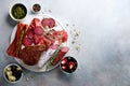 Cold smoked meat plate. Traditional italian antipasto, cutting board with salami, prosciutto, ham, pork chops, olives on Royalty Free Stock Photo