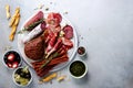 Cold smoked meat plate. Traditional italian antipasto, cutting board with salami, prosciutto, ham, pork chops, olives on Royalty Free Stock Photo