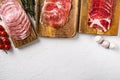Cold smoked meat slices prosciutto, on white stone table background, top view flat lay, with copy space for text Royalty Free Stock Photo