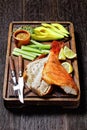Cold smoked red snapper on a cutting board