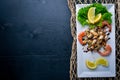 Cold snacks. Seafood, shrimp, mussels, squid, octopus. On a wooden background. Royalty Free Stock Photo