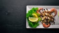 Cold snacks. Seafood, shrimp, On a wooden background. Top view. Free space Royalty Free Stock Photo