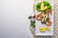 Cold snacks. Seafood, shrimp, octopus. On a wooden background. Top view. Royalty Free Stock Photo