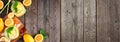 Cold summer lemonade banner with corner border, top view on a dark wood background Royalty Free Stock Photo