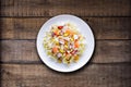 Cold summer salad with rice, coctopus, corn and vegetables. Royalty Free Stock Photo