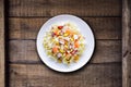 Cold summer salad with rice, coctopus, corn and vegetables. Royalty Free Stock Photo