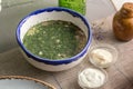 Cold summer soup with cucumber and fresh herbs Okroshka in white bowl on the table Royalty Free Stock Photo