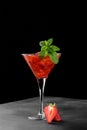 Cold summer strawberry cocktail mojito, margarita, daiquiri in a martini glasse on dark background, close up Royalty Free Stock Photo