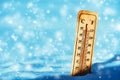 Cold temperature below zero on thermometer in snow Royalty Free Stock Photo