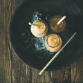 Cold Thai iced tea with milk, flatlay, square crop