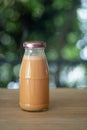 Cold Thai milk tea in a glass bottle Royalty Free Stock Photo