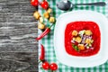 Cold tomato soup in a white square-shaped plate, top view. Royalty Free Stock Photo