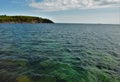 Cold turquoise waters of lake superior off the breakwater facing presque island in marquette michigan Royalty Free Stock Photo