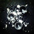 Cold vodka in crushed ice, black background, top view Royalty Free Stock Photo