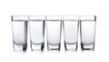 Cold vodka in shot glasses on white Royalty Free Stock Photo
